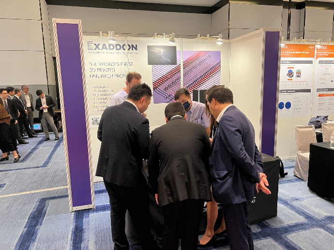 A group of conference attendees asks questions at Exaddon's booth at SW Test Asia 2023 in Taiwan.