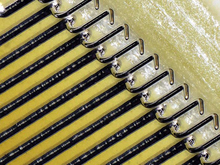 A row of Exaddon micro3D printed probes for parametric wafer testing. 