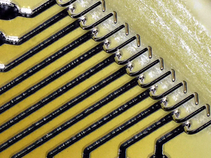 A row of Exaddon micro3D printed probes for parametric wafer testing.