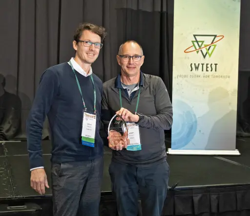Exaddon CEO, Edgar Hepp receiving the award from Jerry Broz, SWTest General Chair.